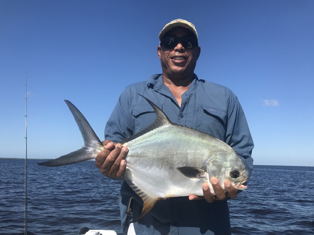 Cousin Paul is pictured with a 21”, fork to tail, Permit he landed while fishing in Charlotte Harbor before a lunch break at Cabbage Key.