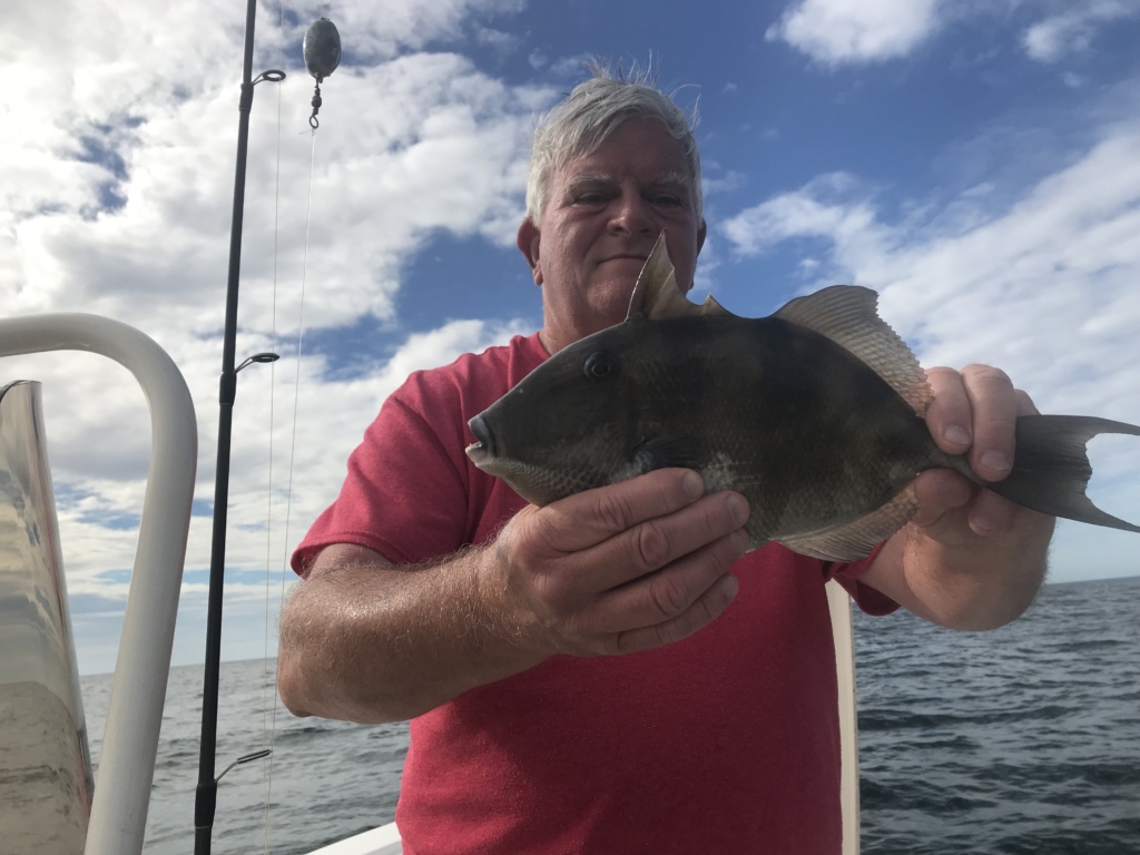 Tom Moslander of Illinois, with one of two nice trigger fish he caught while fishing the Causeway Reef.
