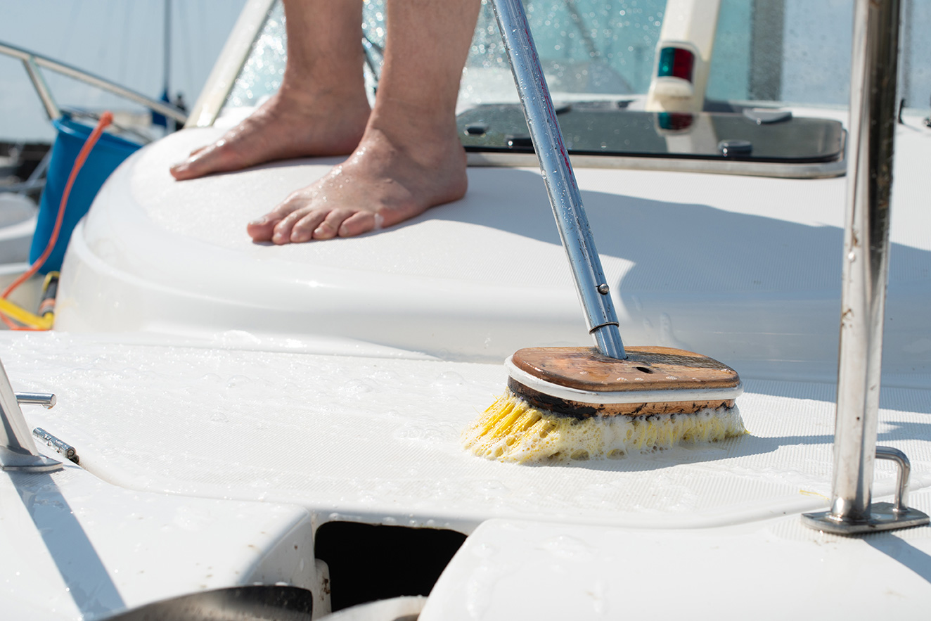 Brush cleaning boat deck